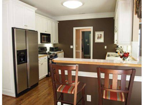 New White Kitchen Cabinets Brown Walls with Simple Decor