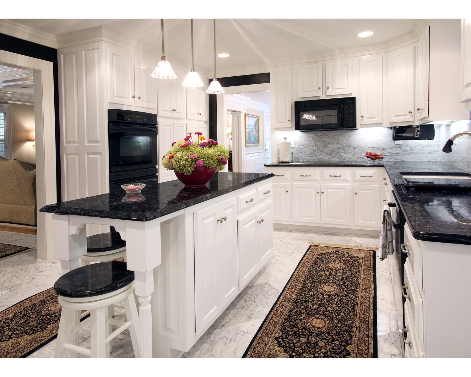 dark blue countertop kitchen black wall white cabinet