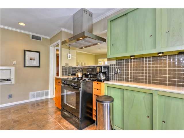 Green stained kitchen cabinets