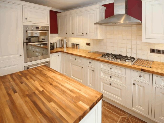 White Kitchen Interior with Wooden Countertop photo - 6