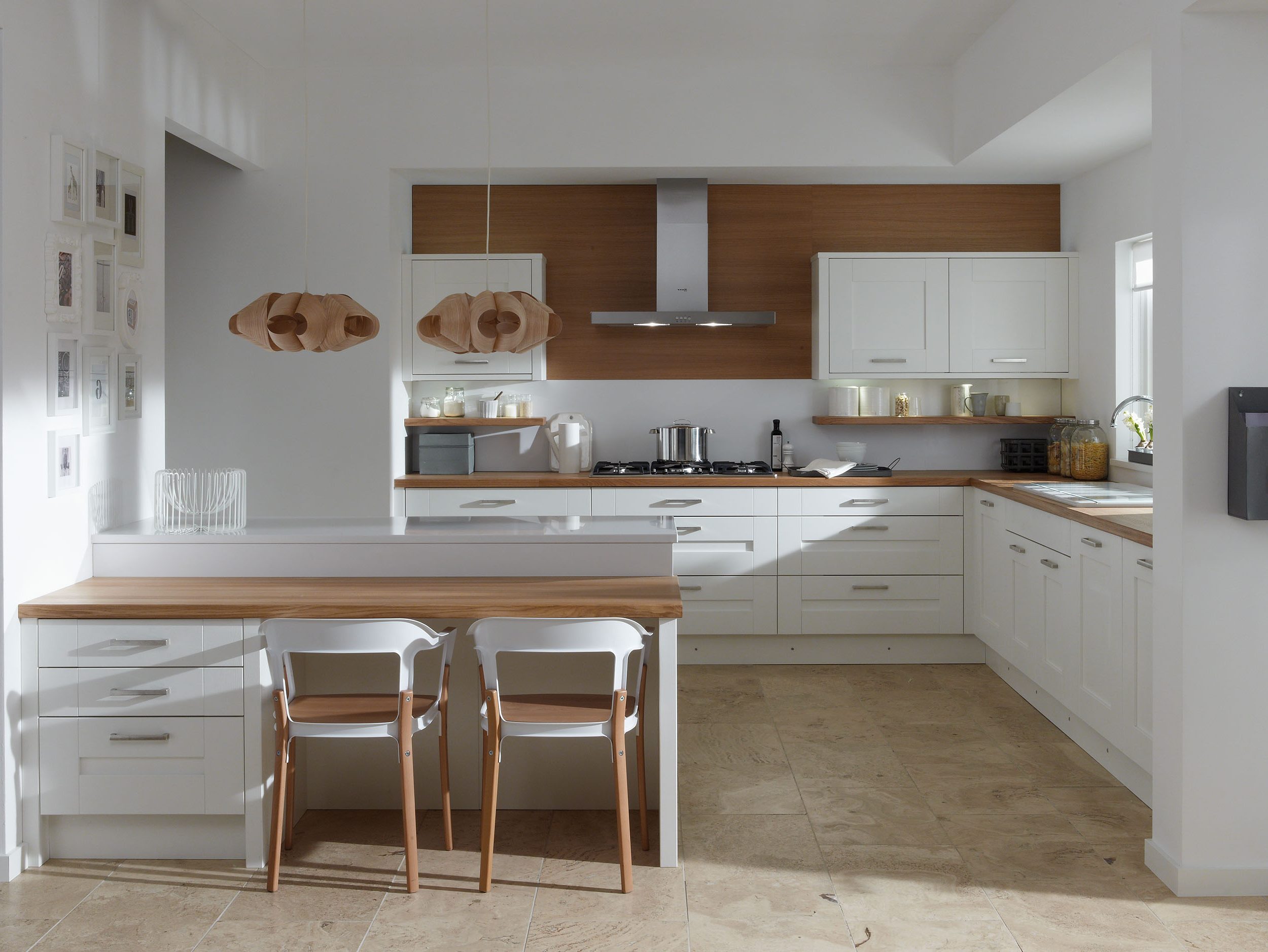 White Kitchen Interior with Wooden Countertop photo - 7