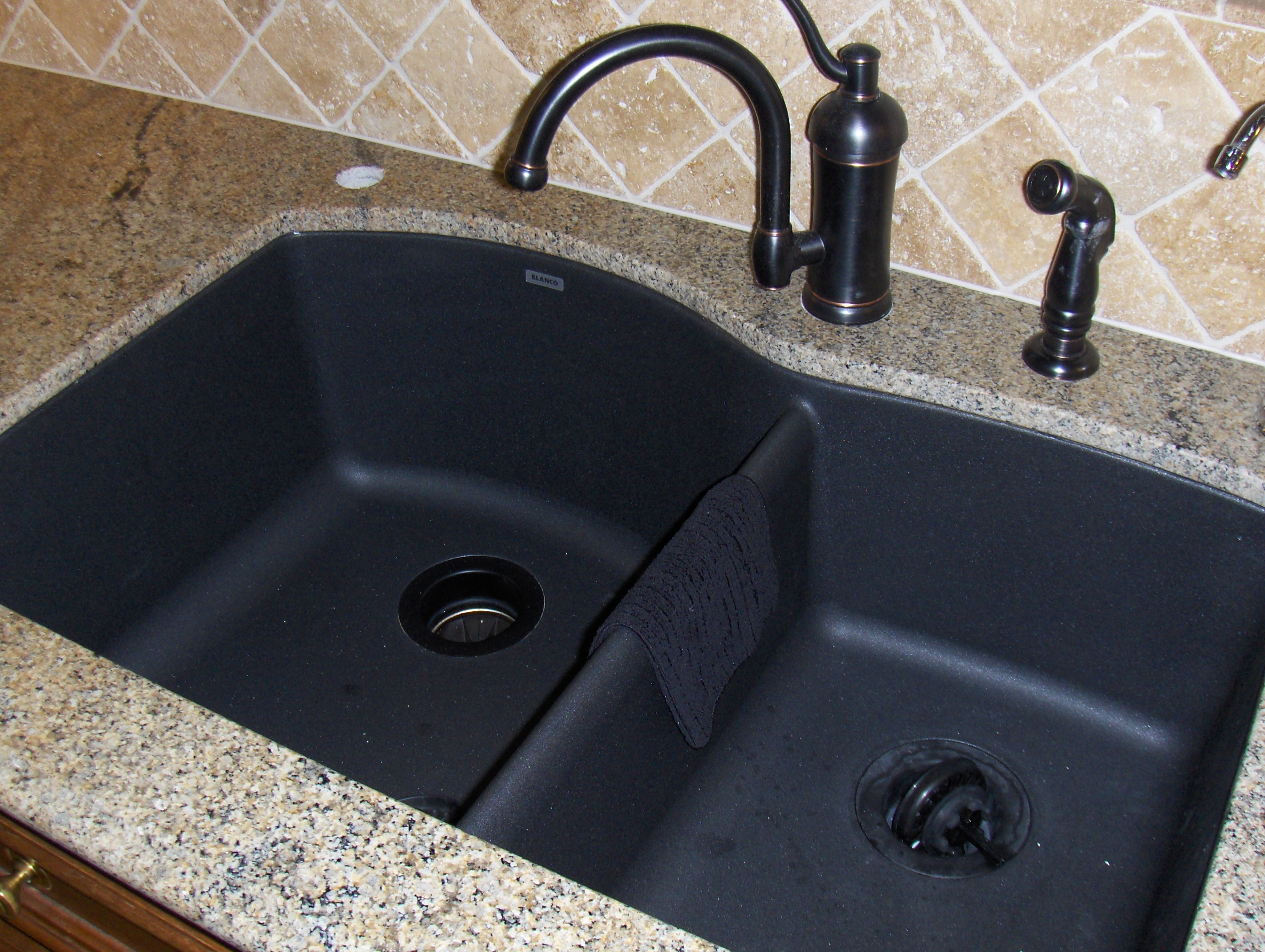 kitchen sink with black granite