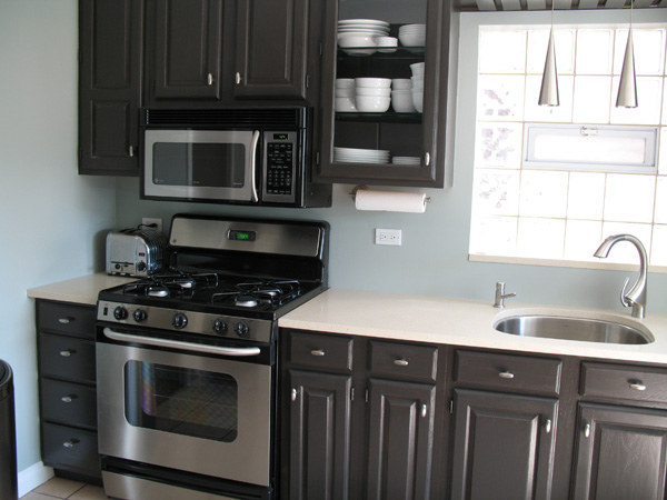 black kitchen cabinets and gray walls photo - 2