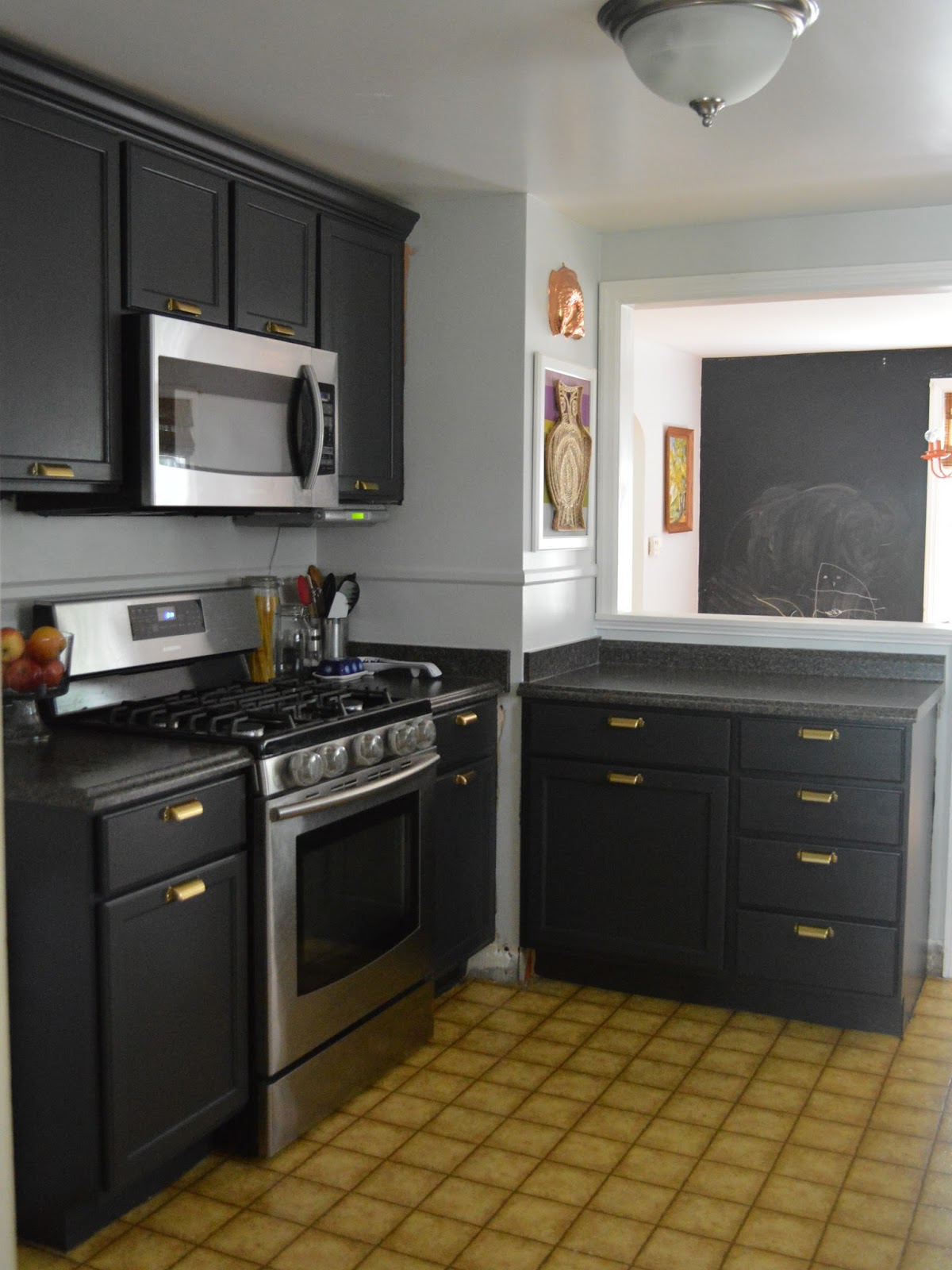 black kitchen cabinets and gray walls photo - 4
