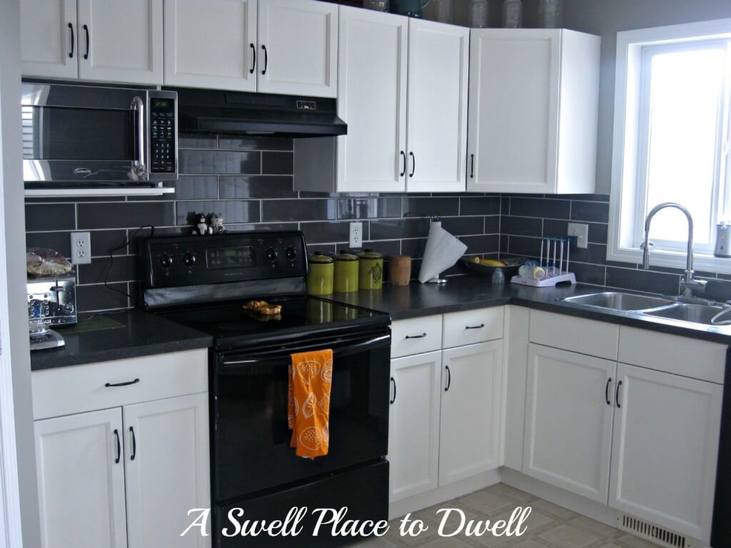 black kitchen cabinets and white appliances photo - 5