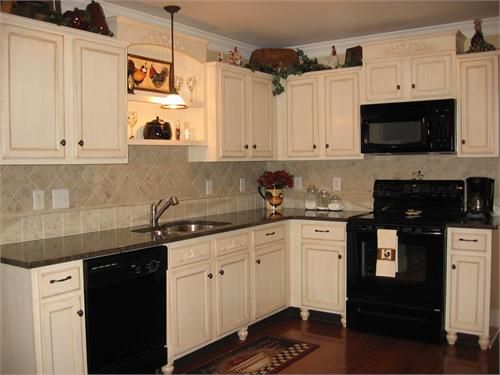 black kitchen cabinets and white appliances photo - 7