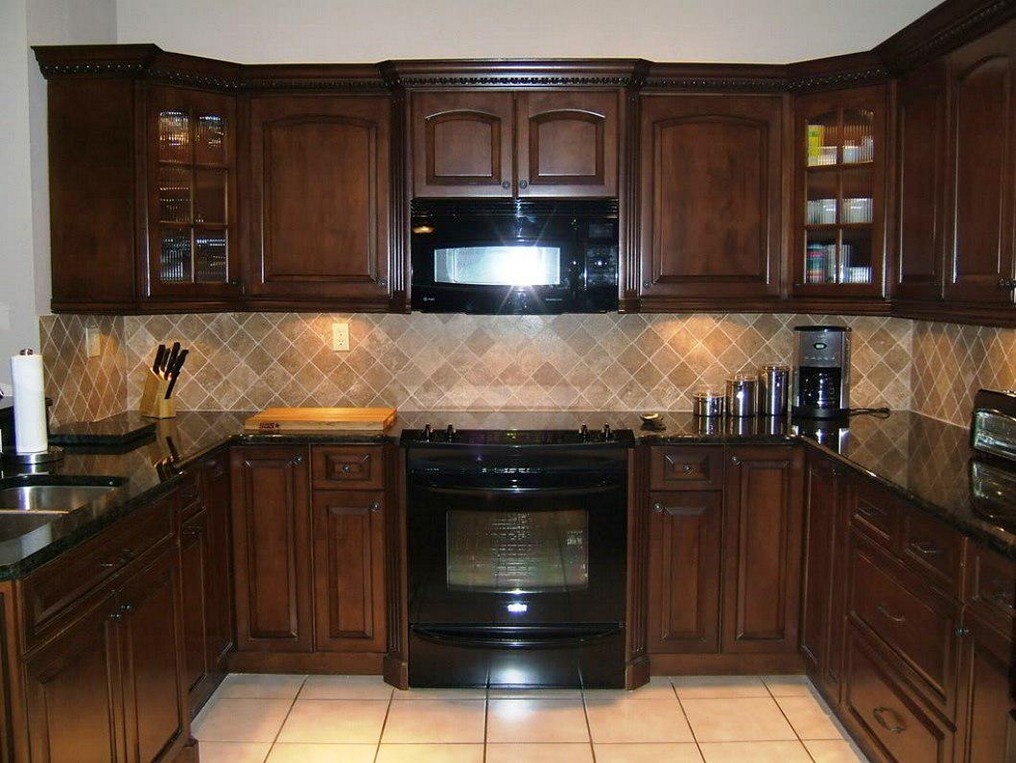 black kitchen cabinets with black appliances photo - 1