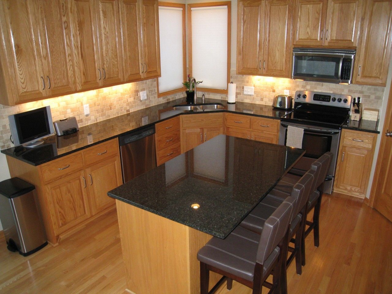black kitchen cabinets with light countertops photo - 6