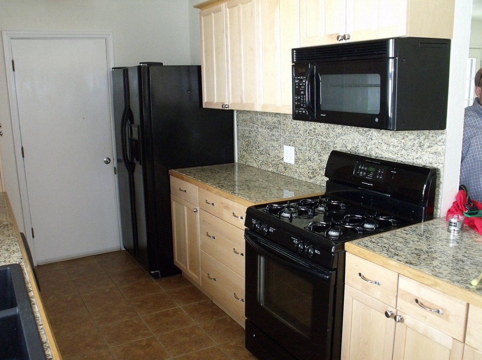 black kitchen cabinets with white appliances photo - 8