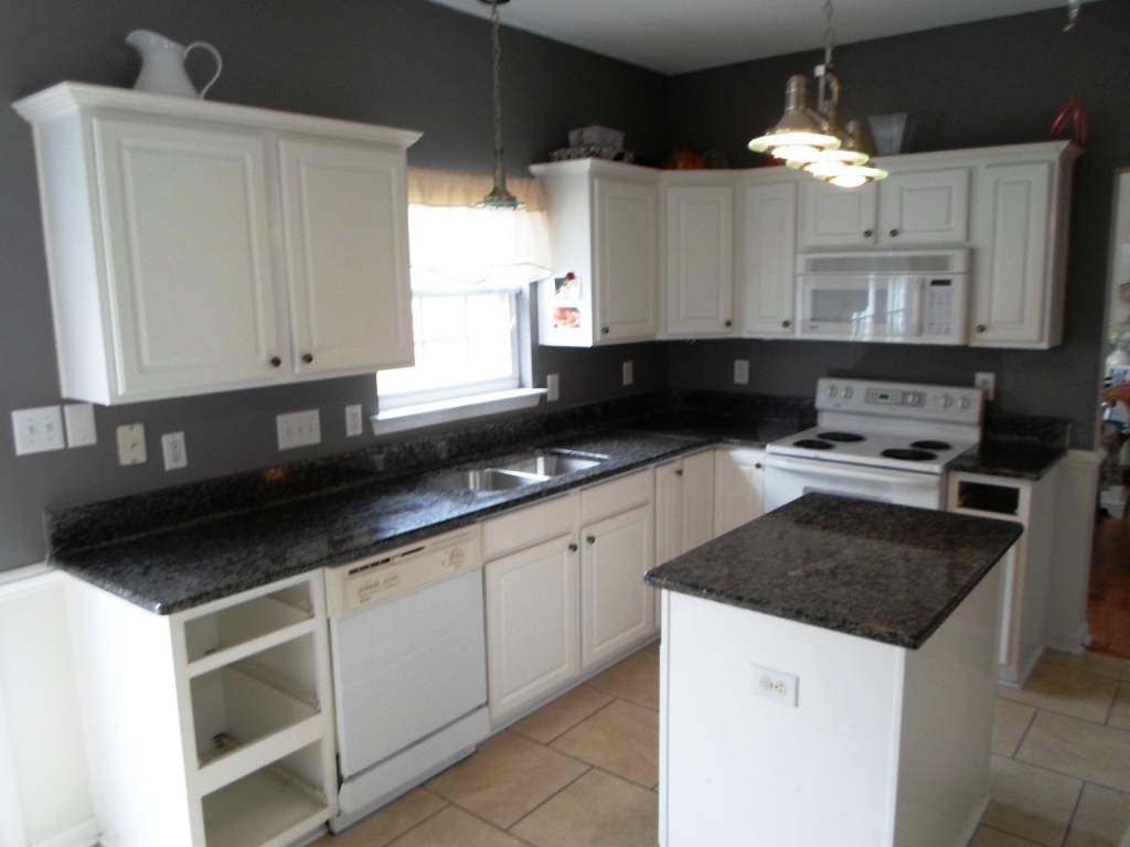 black kitchen cabinets with white counters photo - 5