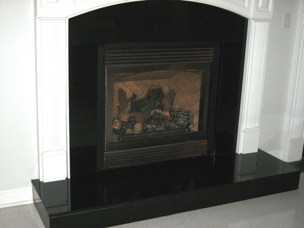 black marble fireplace surround photo - 2