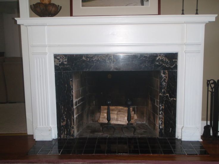 black marble fireplace surround photo - 7