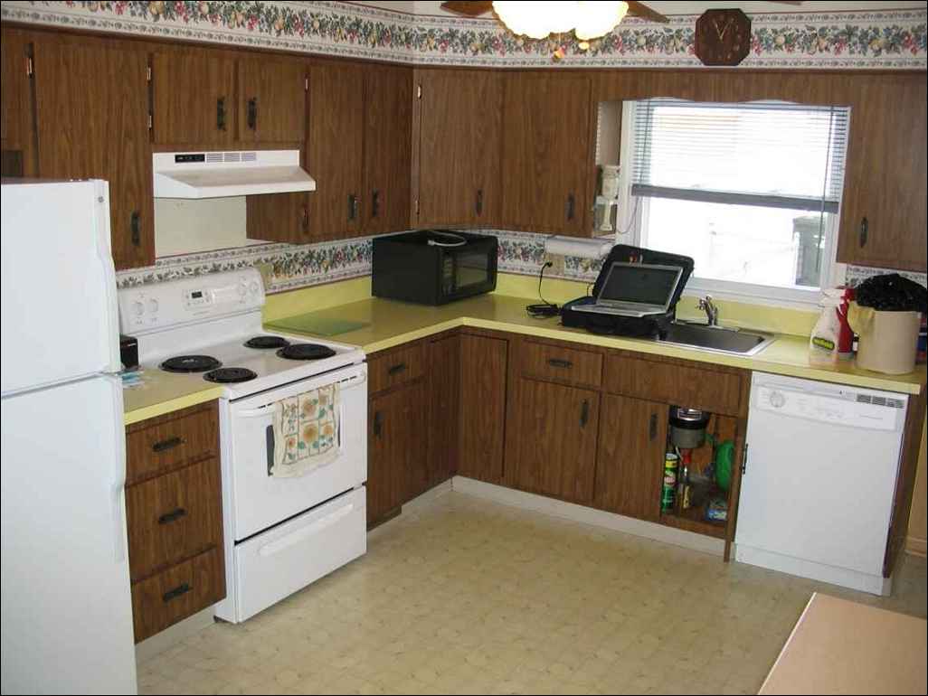 green stained kitchen cabinets photo - 7