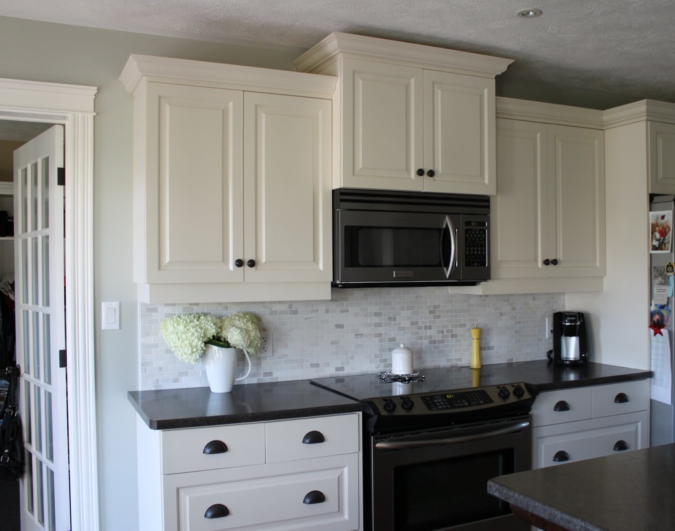 kitchen white cabinets dark backsplash photo - 3
