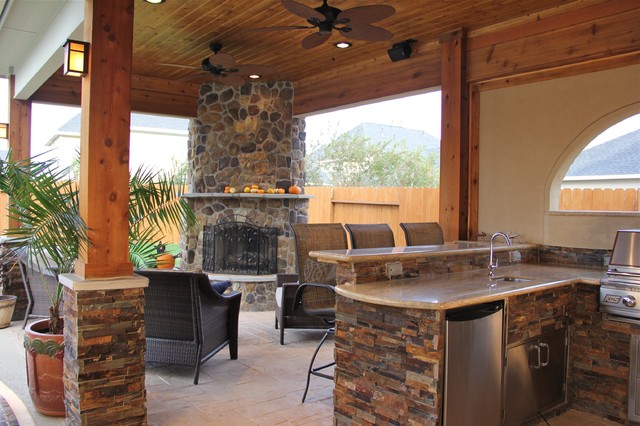 outdoor kitchen and fireplace photo - 10