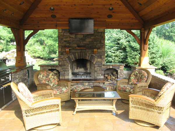 outdoor kitchen and fireplace photo - 2