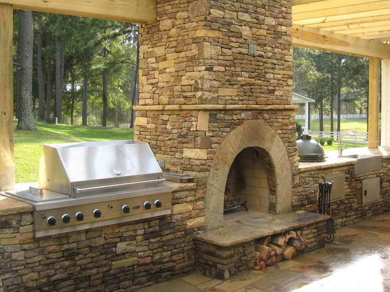 outdoor kitchen and fireplace photo - 4