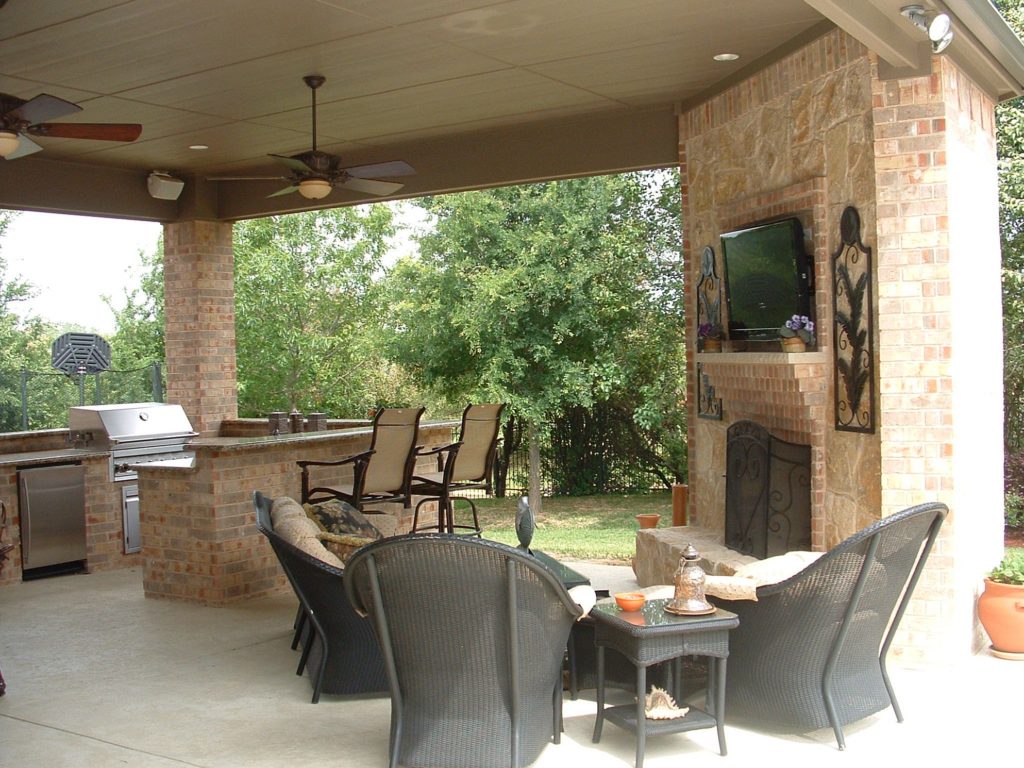 outdoor kitchen and fireplace photo - 5