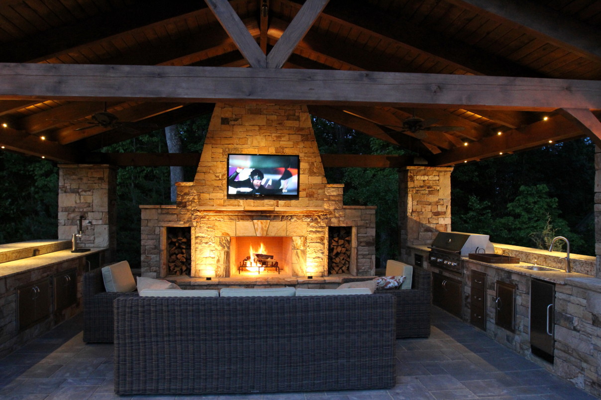 outdoor kitchen and fireplace photo - 8