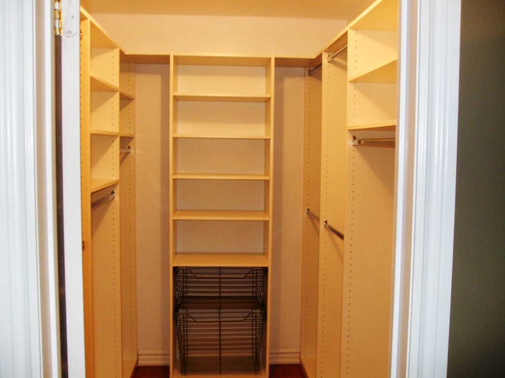 walk in closet in a small bedroom photo - 10