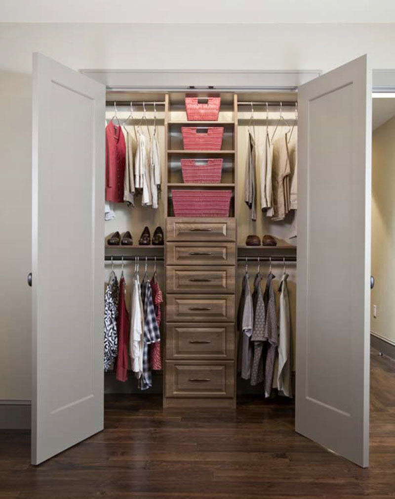 walk in closet in a small bedroom photo - 2